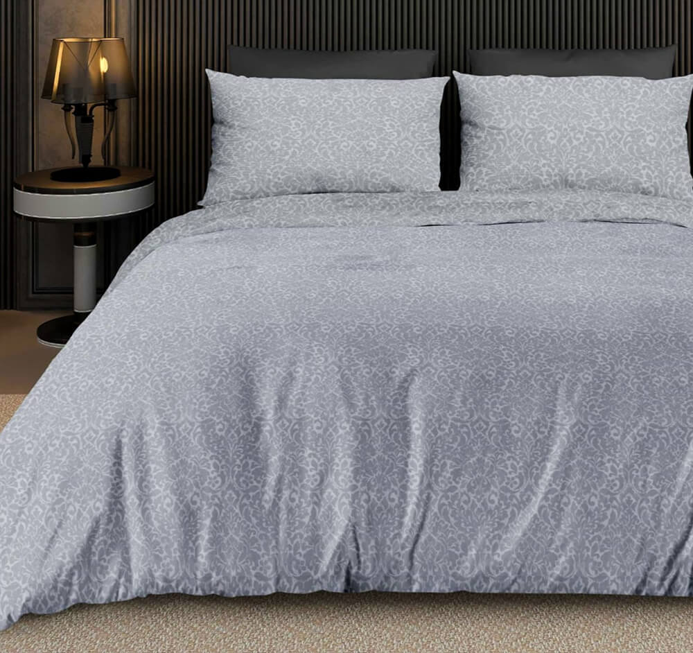 Brocade bedsheet in silver grey with elegant white floral vine pattern and matching pillowcases on a king bed in a modern dark bedroom